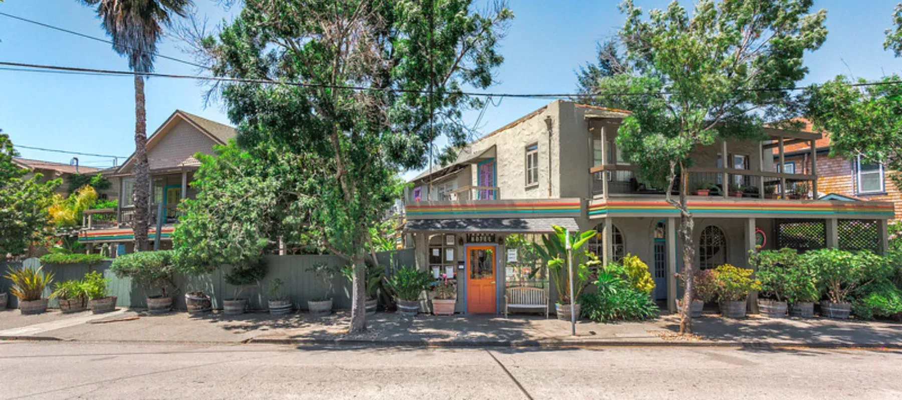 The Panama Hotel on Bayview Street, a two-storey Victorian behind palms and garden planting