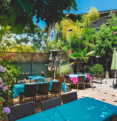 DINE IN STYLE IN OUR LUSH GARDEN PATIO SEATING